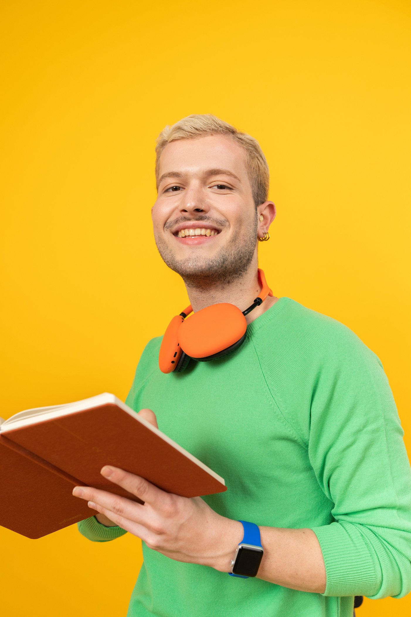 Tech Humans Portrait of a Man with Notebook and Headphones